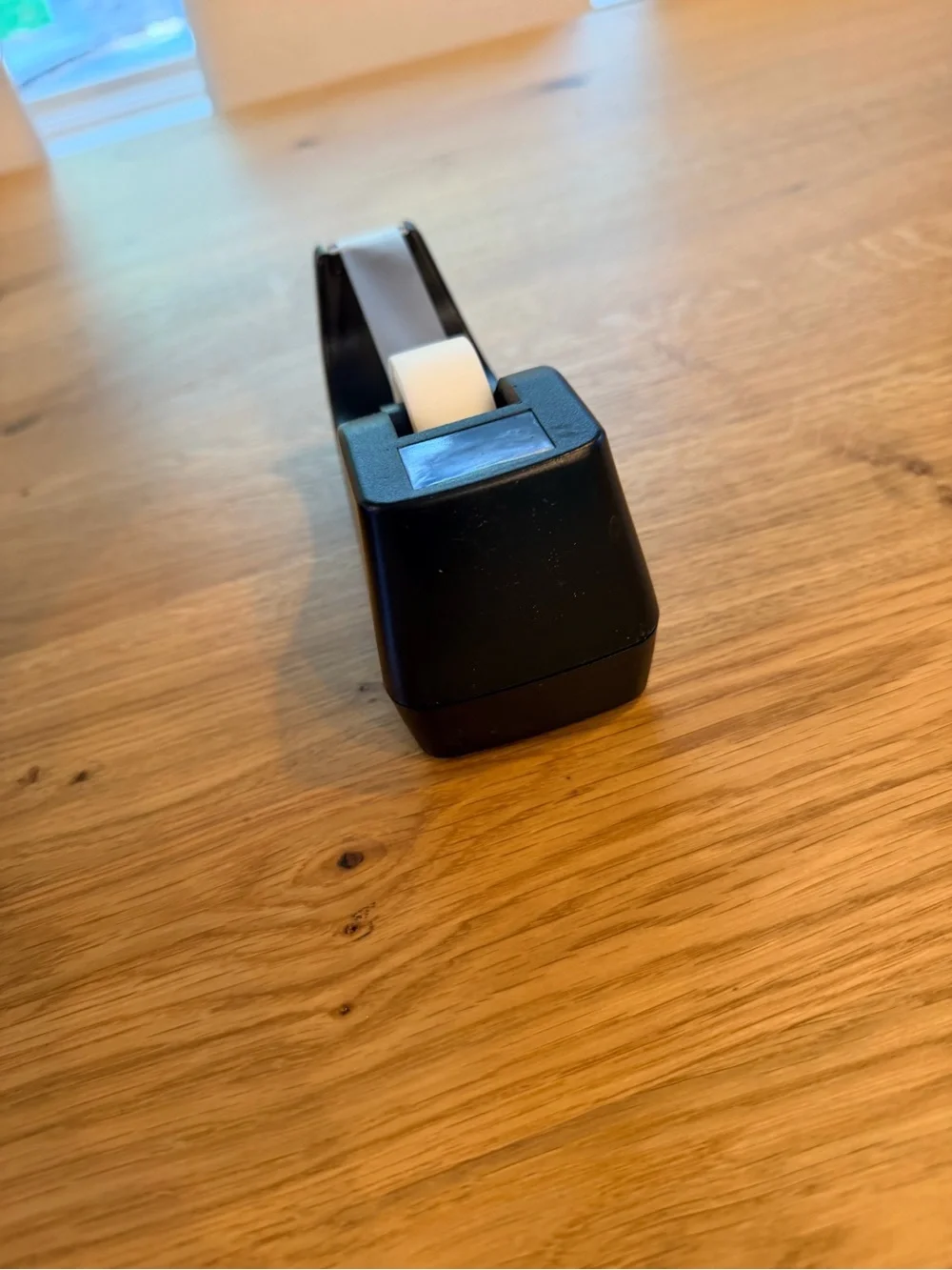 Black Desktop Tape Dispenser with White Roll of tape